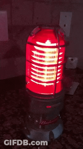 A Budweiser Light Is Lit Up On A Counter GIF