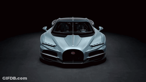 A Bugatti Car Is Shown In A Dark Room GIF