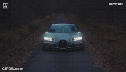 A Bugatti Chiron Is Driving Down A Road With The Words Drivetribe On The Bottom GIF