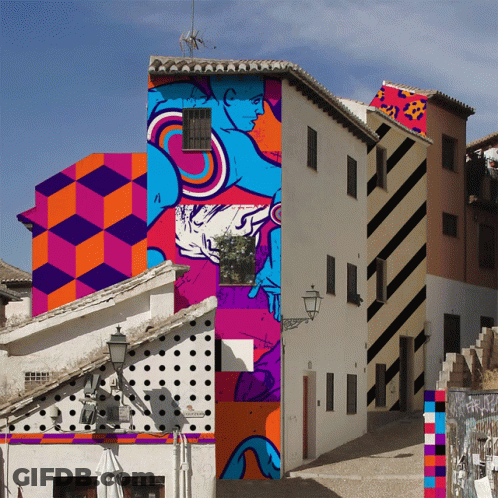 A Building With A Painting Of A Man On The Side GIF