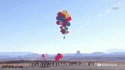 A Bunch Of Balloons Are Flying In The Air With A Youtube Logo In The Background GIF