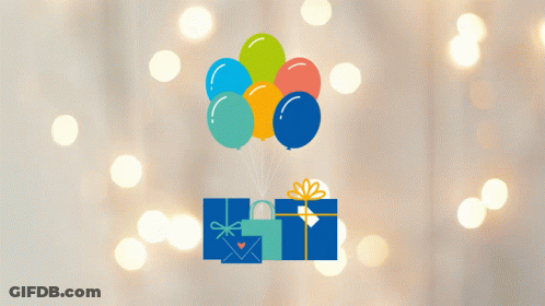A Bunch Of Balloons Are Flying Over A Gift Box With A Heart On It GIF