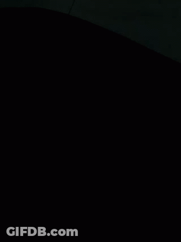A Bunch Of Blankets Are Stacked On Top Of Each Other On A Bed GIF
