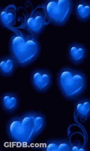 A Bunch Of Blue Hearts On A Dark Background GIF