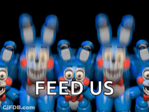 A Bunch Of Blue Stuffed Animals Are Standing Next To Each Other With The Words Feed Us Written Above Them GIF