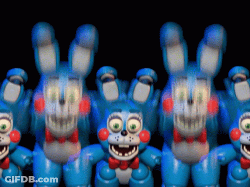 A Bunch Of Blue Stuffed Bunny Rabbits With Red Bow Ties GIF