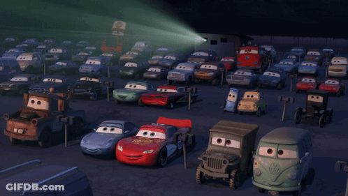 A Bunch Of Cars Are Parked In A Parking Lot And One Of Them Has The Number 55 On It GIF