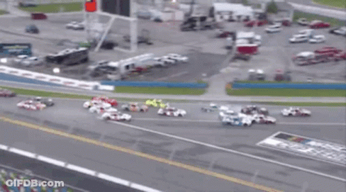 A Bunch Of Cars Are Racing On A Track Sponsored By Busch Coca Cola GIF