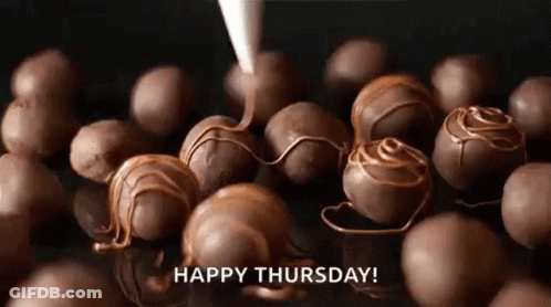 A Bunch Of Chocolate Balls Are Being Covered In Chocolate And A Happy Thursday Greeting . GIF