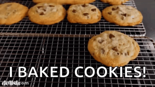 A Bunch Of Chocolate Chip Cookies On A Cooling Rack With The Words " I Baked Cookies " GIF