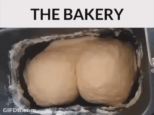 A Bunch Of Dough In A Pan That Says The Bakery On The Top GIF