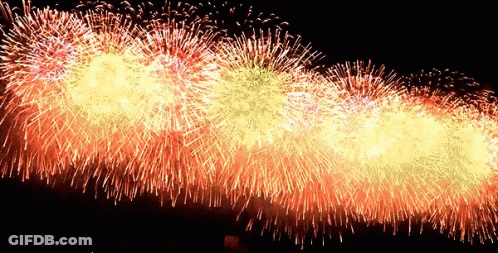 A Bunch Of Fireworks Are Going Off In The Sky GIF