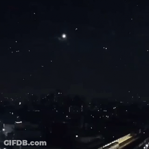 A Bunch Of Fireworks Are Going Off In The Sky GIF