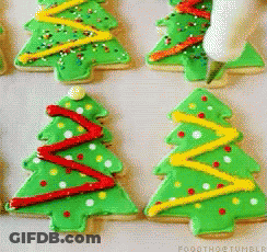 A Bunch Of Green Christmas Trees With Red Yellow And White Decorations GIF