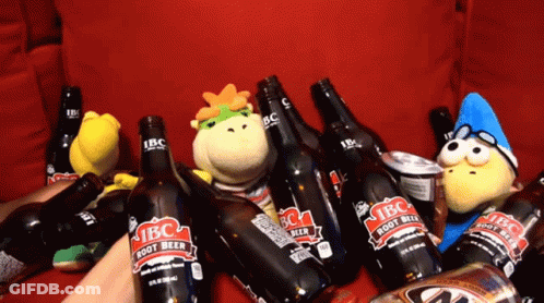 A Bunch Of Ibc Root Beer Bottles On A Couch GIF