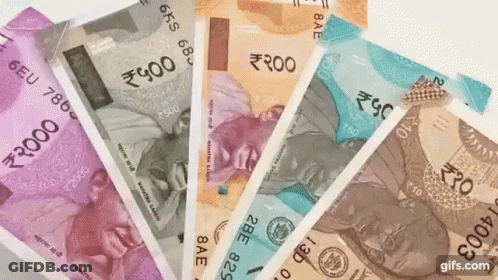 A Bunch Of Indian Currency Is Spread Out In A Fan GIF