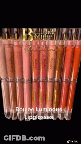 A Bunch Of Lipglosses Are Lined Up On A Table GIF