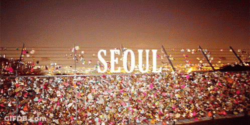 A Bunch Of Locks On A Fence With The Word Seoul On It GIF