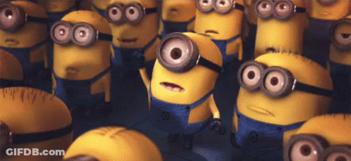 A Bunch Of Minions With Big Eyes Are Standing Next To Each Other . GIF
