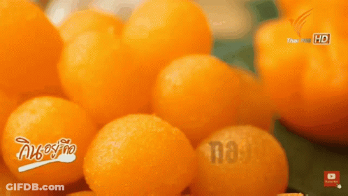 A Bunch Of Oranges Are Sitting On A Table With The Words Thai Pbs Hd On The Bottom GIF