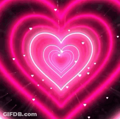 A Bunch Of Pink Hearts Are Glowing On A Black Background . GIF