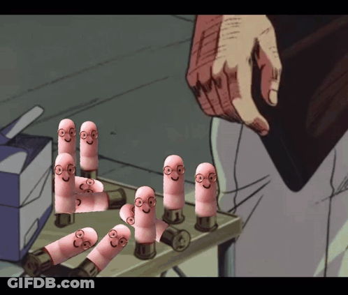 A Bunch Of Pink Pills With Faces On Them Are Sitting On A Table GIF