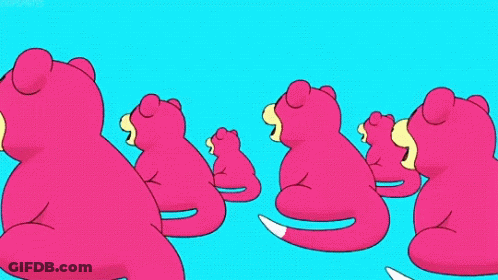 A Bunch Of Pink Stuffed Animals Are Sitting In A Row GIF