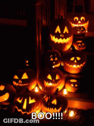 A Bunch Of Pumpkins Are Lit Up With The Words Boo GIF