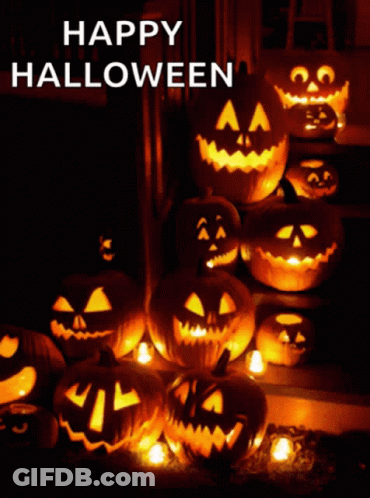 A Bunch Of Pumpkins Are Lit Up With The Words Happy Halloween Written Above Them GIF