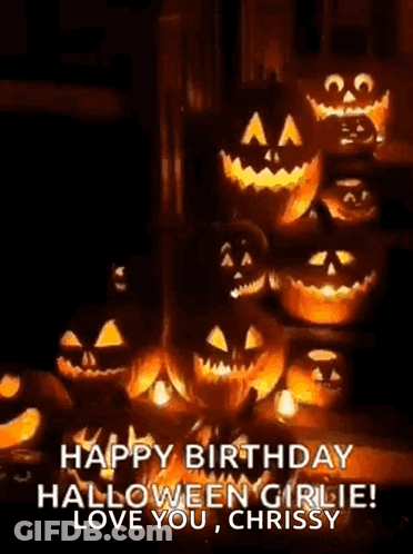 A Bunch Of Pumpkins With Faces Carved Into Them Are Sitting On Top Of Each Other . GIF