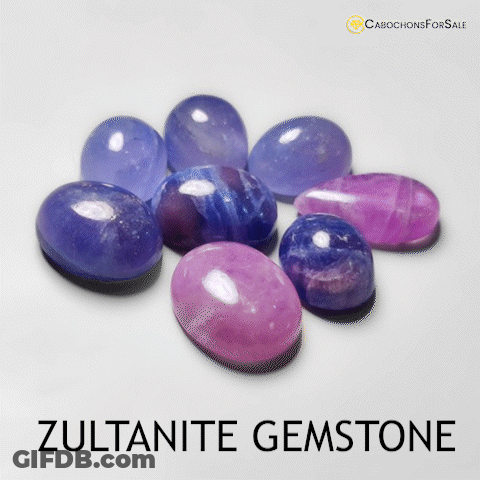 A Bunch Of Purple And Blue Stones With The Words Zultanite Gemstone GIF