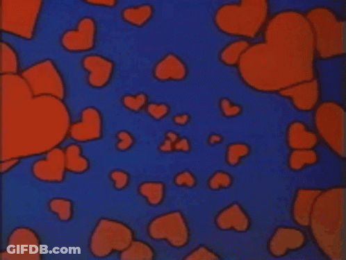 A Bunch Of Red Hearts Are Floating In The Air On A Blue Background GIF