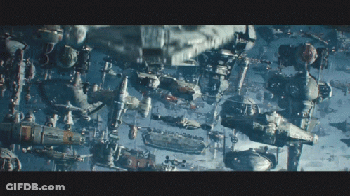 A Bunch Of Space Ships Are Floating In The Sky GIF