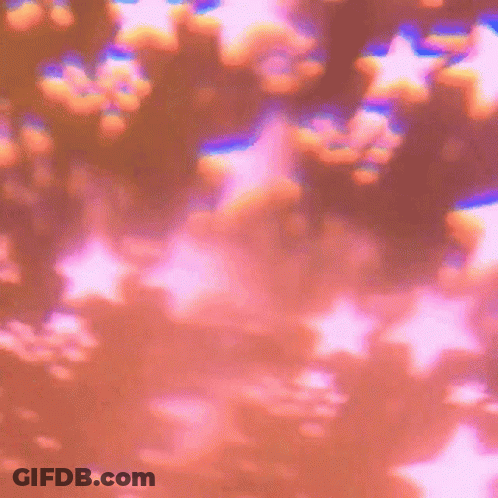 A Bunch Of Stars Are Floating In The Air On A Pink Background GIF