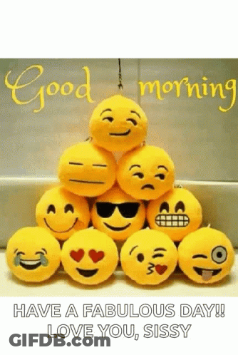 A Bunch Of Stuffed Smiley Faces Are Stacked On Top Of Each Other With The Words `` Have A Fabulous Day ! `` GIF