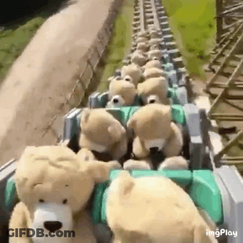 A Bunch Of Teddy Bears Are Riding A Roller Coaster GIF