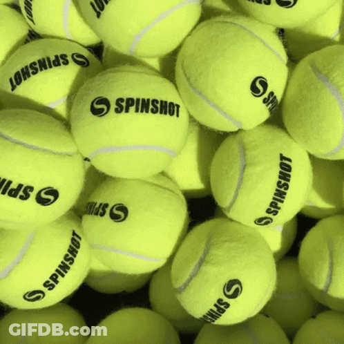 A Bunch Of Tennis Balls With Spinshot On Them GIF