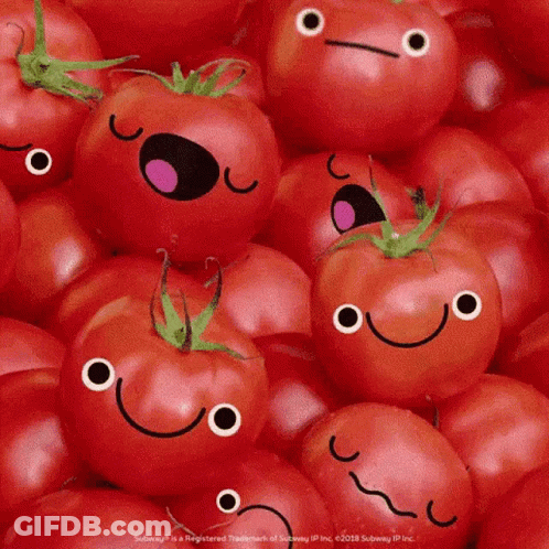 A Bunch Of Tomatoes With Faces On Them GIF