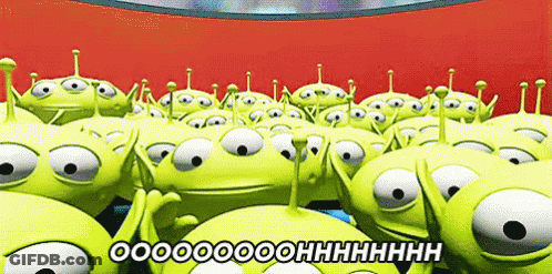 A Bunch Of Toy Story Aliens Are Standing In A Circle GIF