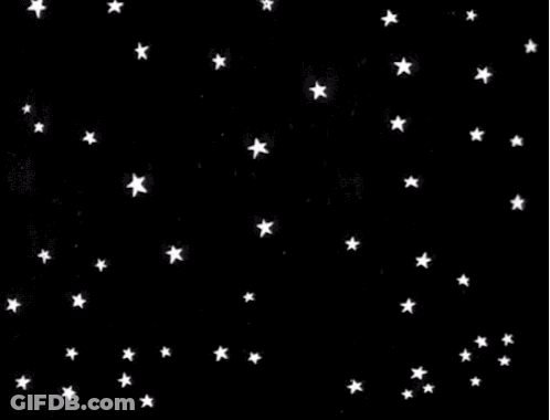 A Bunch Of White Stars Are Falling In The Night Sky On A Black Background . GIF