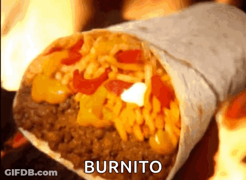 A Burrito Is Sitting On A Table With Flames In The Background .. GIF
