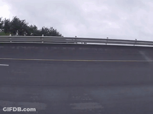 A Bus Is Driving Down A Road And The Word Mercedes Is On The Side GIF