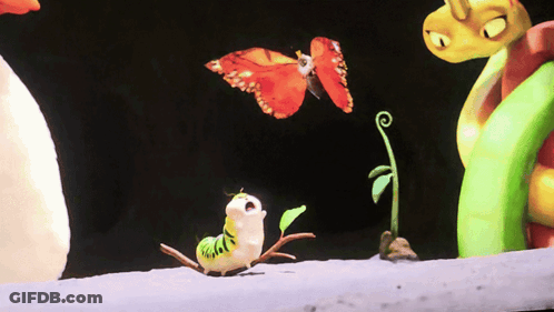 A Butterfly Is Flying Over A Caterpillar With A Green Plant In The Background GIF