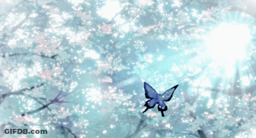 A Butterfly Is Flying Through A Tree With Flowers On It GIF