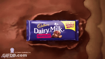 A Cadbury Dairy Milk Bar With A Teddy Bear On The Front GIF