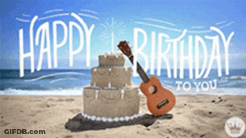 A Cake And Guitar On The Beach With The Words Happy Birthday To You GIF