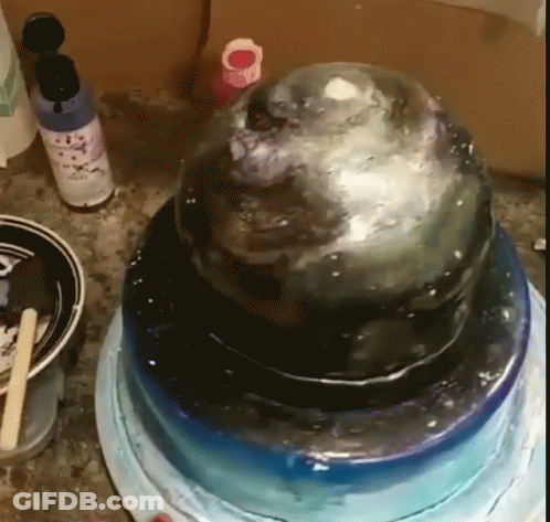 A Cake Is Sitting On Top Of A Blue Plate GIF