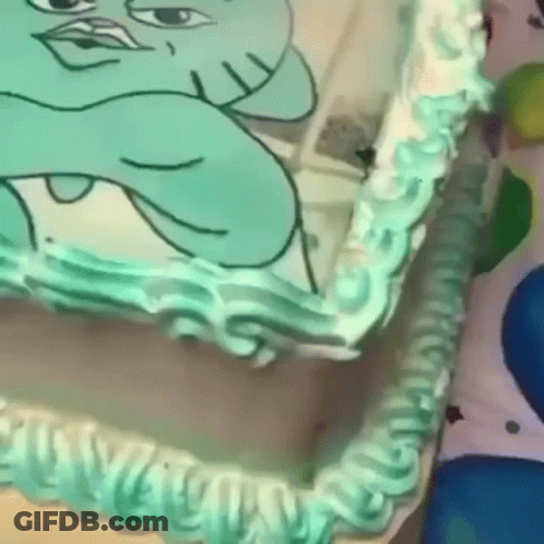 A Cake With A Picture Of A Cartoon Character On It . GIF
