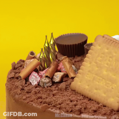 A Cake With Candles And A Cookie That Says Butter GIF