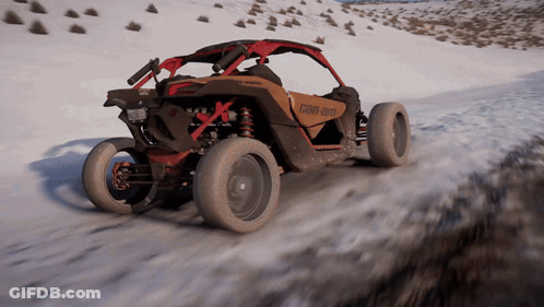 A Can-Am Buggy Is Driving Down A Snow Covered Road GIF